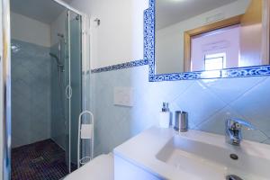 a bathroom with a sink and a shower at Sogno Blu in Furore