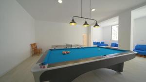 a living room with a pool table in it at Villa Panoramic in Santa Susanna