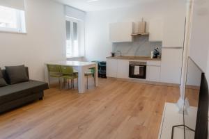 a kitchen and living room with a table and chairs at Mara's home in San Salvo