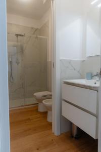 a bathroom with a shower and a toilet and a sink at Mara's home in San Salvo +49 photos