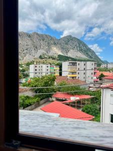 a view from a window of a city with buildings at Flat in Leskovik in Leskovik
