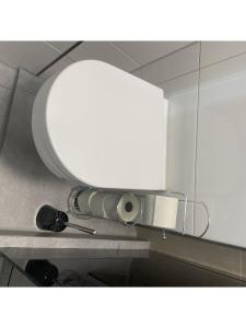 a bathroom with a round mirror on a counter at Maisonette am Burg in Möckmühl