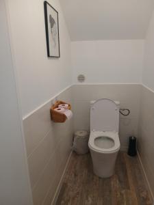 a small bathroom with a toilet in a room at Chez lydie et jeff in Laudun +6 photos