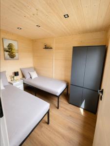 a small room with two beds and a couch at Górskie Zakątek in Kalna