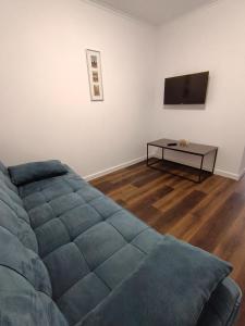a living room with a couch and a table at Apartamente 9 Teo in Baile Felix