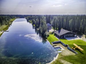 an aerial view of a lake with a lodge at Biplane Hangar Lakeviews with Northern Lights in North Pole