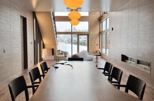 a large conference room with a large table and chairs at THE OneThird HAKUBA Slopefront Villas in Hakuba