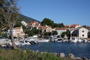 a group of boats are docked in a marina at Apartments Pegla in Nerezine