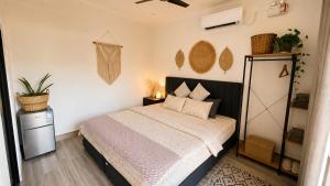 a bedroom with a bed in a room at Grande Maldives Inn in Himmafushi +35 photos
