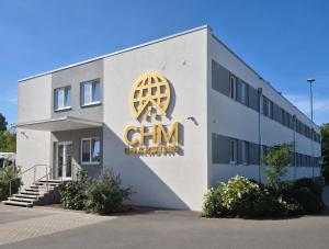 a building with a sign on the side of it at CHM Boarding Worms in Worms