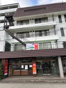 a building with a building with a fire escape at RB hotel in Aizuwakamatsu