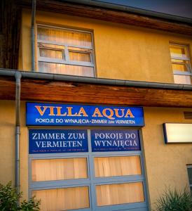 a sign on the side of a building at Villa Aqua in Międzyzdroje