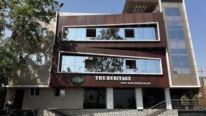 a building with a sign on the front of it at The Heritage in Dumka