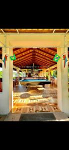 a large room with a table with a surfboard in it at The Mountainstream Lodge in Lethem