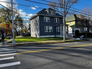 a blue house on the corner of a street at Lg2NY in Westerleigh
