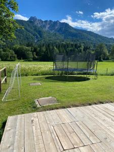 a basketball hoop and a goal in a field at Apartma Confine in Rateče