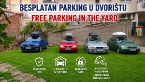 a group of three cars parked in a yard at Apartment Wonderland in Niš