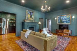 a living room with a couch and a fireplace at 2-Unit Bundle in Eustis: Walk to Ferran Park! in Eustis