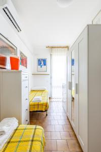 a bedroom with two beds in a room at Piscina Gratis, Pool View Oasis Pool View in Lido Adriano +34 photos