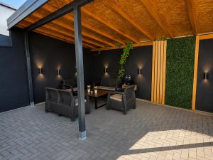 acovered patio with a table and chairs at Promo Studio Apartment in Pirot