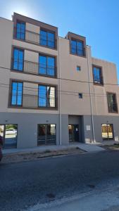 a large building with windows on the side of it at 2 4 D2 Mini Condos Studio Loft West facing in Tivat