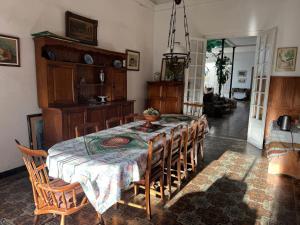 a dining room with a table and chairs at Casa Grande in Mercedes