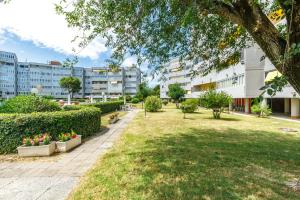 a park in a city with buildings at Piscina Gratis, Pool View Oasis Pool View in Lido Adriano