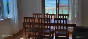 a dining room table and chairs with a view of the ocean at Villa Mina beachhouse in Jambiani +68 photos