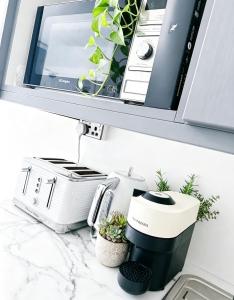 a kitchen counter with a coffee maker and a toaster at CROKE PARK STUDIO in Dublin +40 photos
