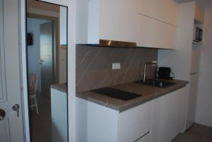 a kitchen with a sink and a counter top at Busho Residence 1 in Naousa +31 photos