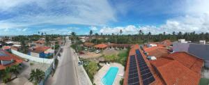 an overhead view of a residential neighborhood with roofs at Pousada Parque dos Coqueiros in Piaçabuçu +7 photos