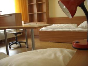 A bed or beds in a room at Kolping Campus Krems