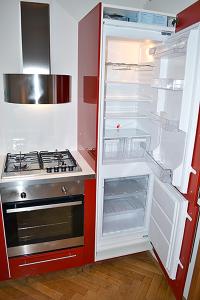 a refrigerator with its door open next to a stove at Classic 2BDR suite by Ruterra in Prague