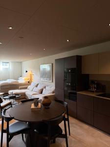 a living room with a couch and a table at The Cozy Nook - Modern scandinavisk Studio in Kristianstad