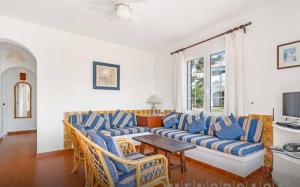 a living room with a couch and chairs and a table at Apartment for 6 with a private terrace in Son Bou in Son Bou