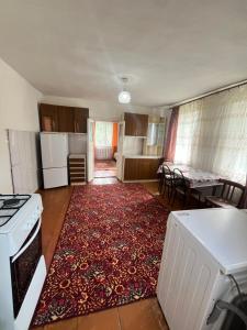 a kitchen with a rug on the floor of a room at Dream house in Türgen