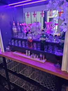 a table with a bunch of glasses on it at The Bugle Hotel in Titchfield