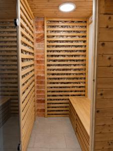 a sauna with wooden walls and a ceiling at Villa Retró Harmónia in Visegrád
