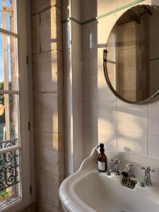 a bathroom with a sink and a mirror at Domaine de Chaunac in Chaunac +20 photos