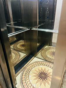 an open oven with a tile floor in a room at Dragon Hotel Ha Noi in Hanoi
