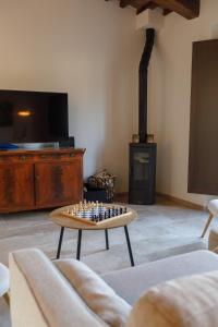 a living room with a chess board on a coffee table at Peaceful Umbria views & heated infinity pool in Umbertide