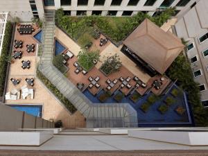 a rendering of a courtyard in a building at Novotel Bengaluru Outer Ring Road in Bangalore