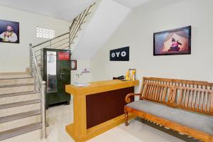 a room with a bench and a stair case at Hotel O SSR residency in Venjāramūdu