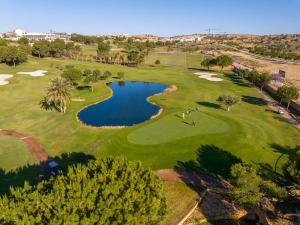 an overhead view of a golf course with a pond at Dúplex 2 plantas en Centro histórico de Elche in Elche