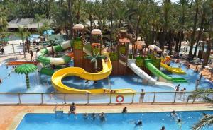 a pool at a resort with a water park at Dúplex 2 plantas en Centro histórico de Elche in Elche