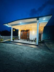 a white pergola on a house at night at Villa Calista Weligama in Weligama