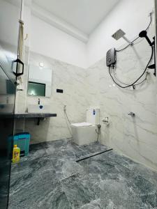 a bathroom with a sink and a toilet in a room at Villa Calista Weligama in Weligama +43 photos