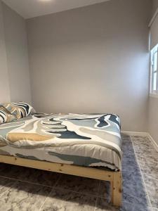 a bedroom with a bed in a room at El Volcan in Los Llanillos +3 photos
