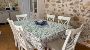 a table with a table cloth on it with a plate on it at Casa Boutique Margarita in Peniscola