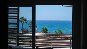 a view of the ocean from a hotel window at AZAK BLUE OTEL in Okurcalar